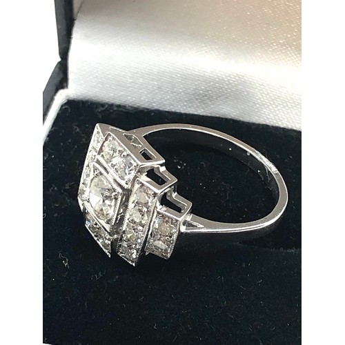 156 - An Art Deco style platinum diamond ring; white diamonds in geometric millegrain settings. Stamped 'P... 