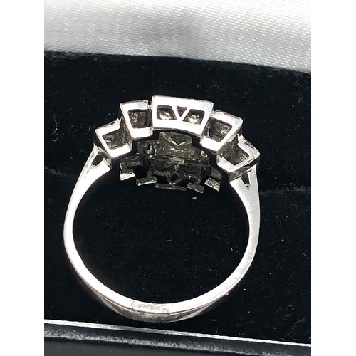 156 - An Art Deco style platinum diamond ring; white diamonds in geometric millegrain settings. Stamped 'P... 