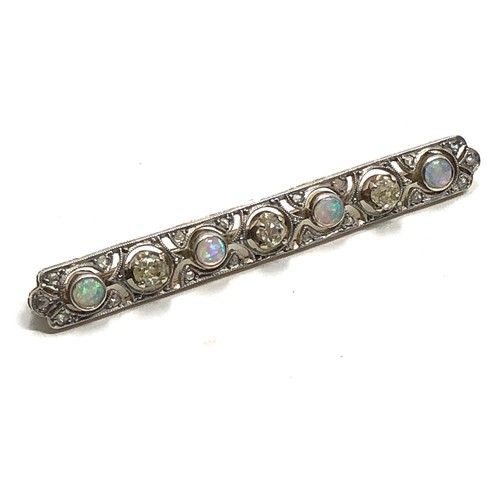 153 - An antique 18 carat gold opal & diamond bar brooch set with alternating opals &  old cut diamonds su... 