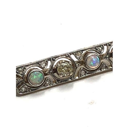 153 - An antique 18 carat gold opal & diamond bar brooch set with alternating opals &  old cut diamonds su... 