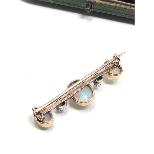 181 - Boxed antique 15ct gold opal & rose diamond brooch;  set three opal cabochons and two rose cut diamo... 