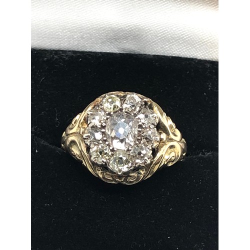 134 - A Fine antique 15 ct gold old cut diamond ring with an impressive cluster of old-mine cut diamonds e... 