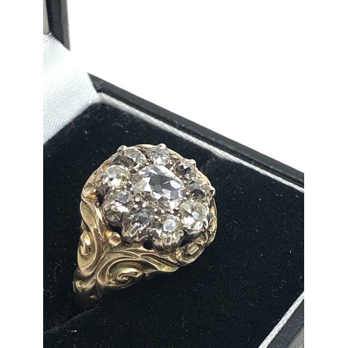 134 - A Fine antique 15 ct gold old cut diamond ring with an impressive cluster of old-mine cut diamonds e... 