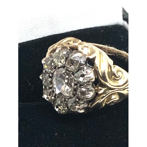 134 - A Fine antique 15 ct gold old cut diamond ring with an impressive cluster of old-mine cut diamonds e... 