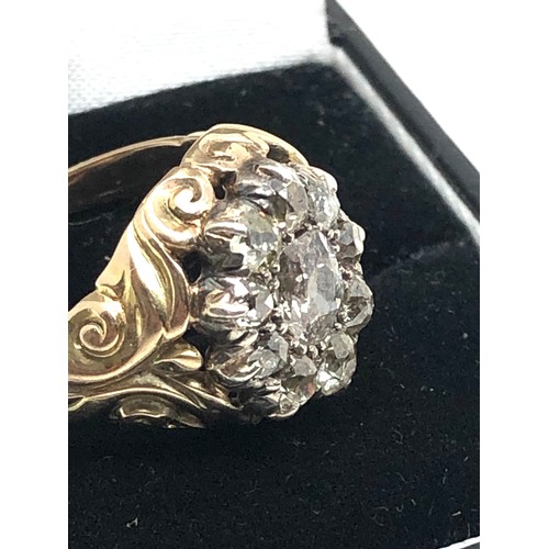 134 - A Fine antique 15 ct gold old cut diamond ring with an impressive cluster of old-mine cut diamonds e... 