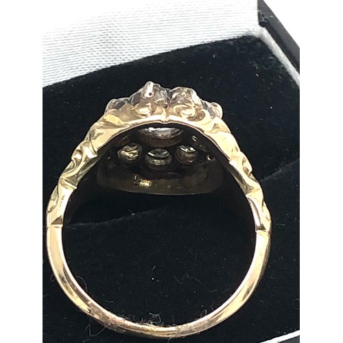 134 - A Fine antique 15 ct gold old cut diamond ring with an impressive cluster of old-mine cut diamonds e... 