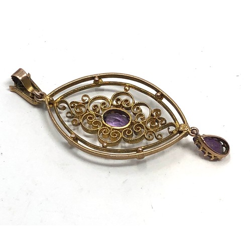 174 - Antique 9 ct gold amethyst & pearl pendant with open worked wire style body and set with  2 amethyst... 