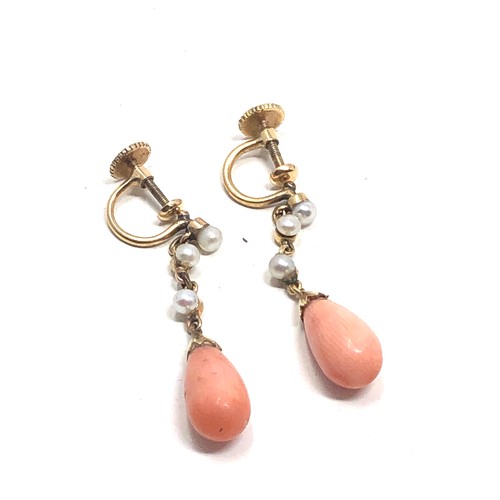 183 - A pair of antique 9ct gold coral drop & pearl set earrings  Drops 31 mm long Approx. 3.6 grams