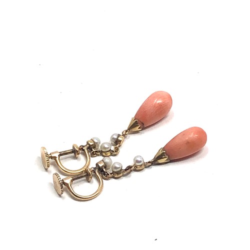 183 - A pair of antique 9ct gold coral drop & pearl set earrings  Drops 31 mm long Approx. 3.6 grams