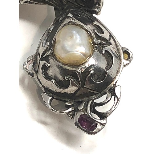 139 - Antique silver ornate helmet brooch, set with pearls,  rose cut diamonds and  rubies. measures appro... 