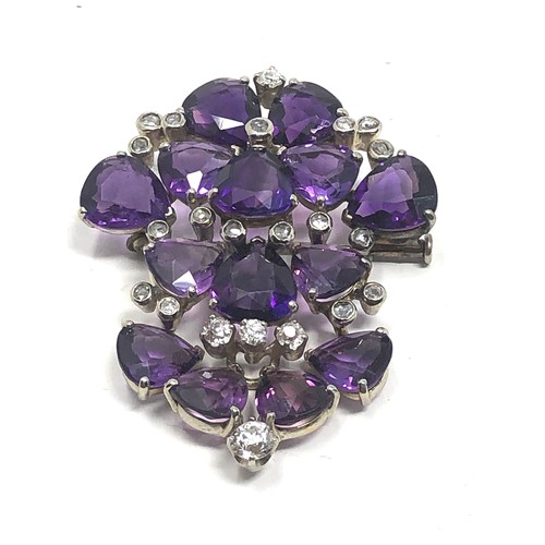 106 - A vintage 18ct white gold Diamond & amethyst brooch;  set with bright heart shaped amethysts and dia... 