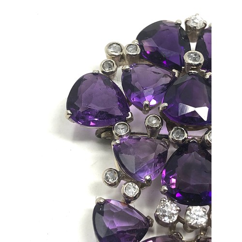 106 - A vintage 18ct white gold Diamond & amethyst brooch;  set with bright heart shaped amethysts and dia... 