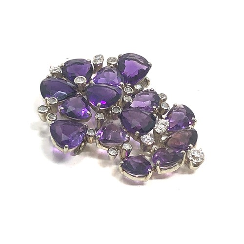 106 - A vintage 18ct white gold Diamond & amethyst brooch;  set with bright heart shaped amethysts and dia... 