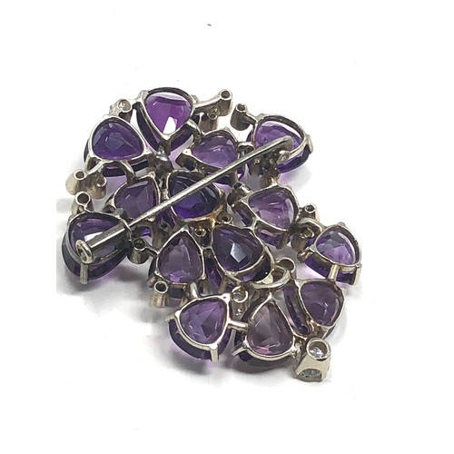 106 - A vintage 18ct white gold Diamond & amethyst brooch;  set with bright heart shaped amethysts and dia... 