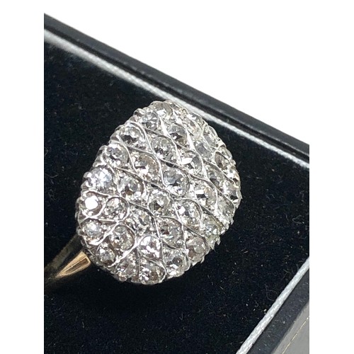 155 - Fine  18 carat gold diamond ring; set with a large array of sparkling old cut diamonds in platinum s... 