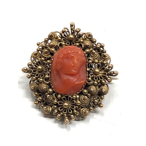 138 - Antique 15ct gold carved coral cameo brooch measures approx 2.9cm by 2.6cm weight 6.6g