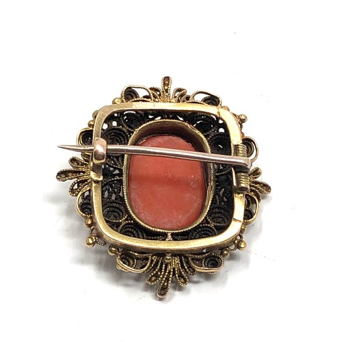 138 - Antique 15ct gold carved coral cameo brooch measures approx 2.9cm by 2.6cm weight 6.6g