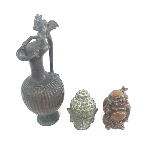 84 - Bronze metal buddha head hollow, resin buddha figure and a metal dragon water jug