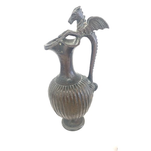 84 - Bronze metal buddha head hollow, resin buddha figure and a metal dragon water jug