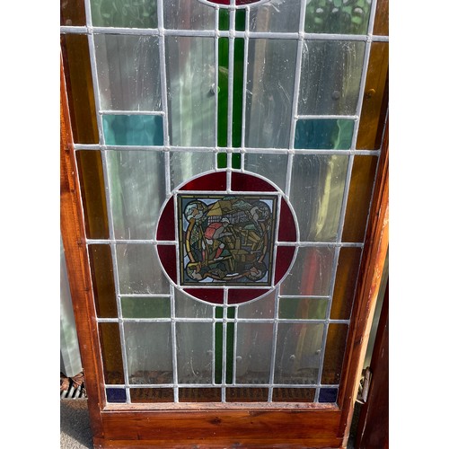 557 - 2 Vintage stained glass doors with side panels, approximate measurements: Length 125 inches, Height ... 