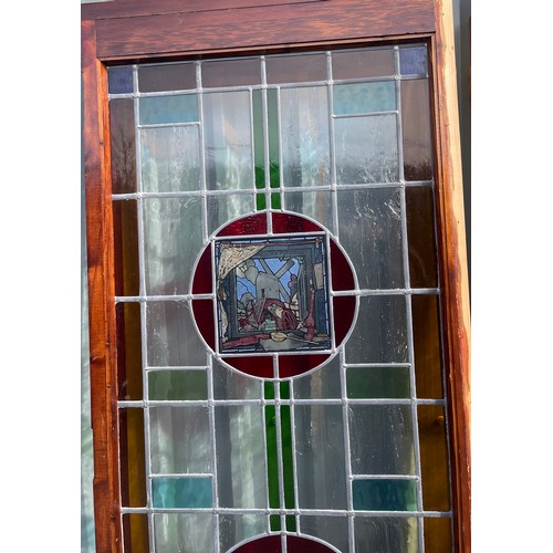 557 - 2 Vintage stained glass doors with side panels, approximate measurements: Length 125 inches, Height ... 