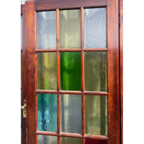 557 - 2 Vintage stained glass doors with side panels, approximate measurements: Length 125 inches, Height ... 