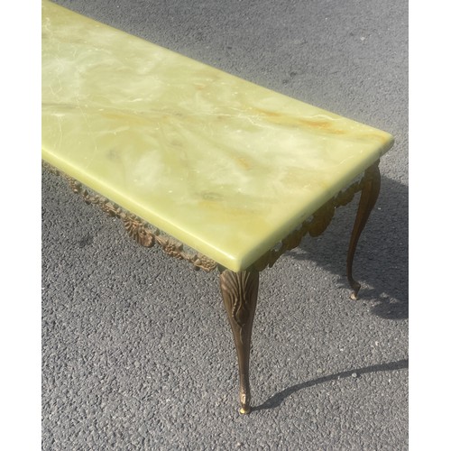 543 - Brass and faux onyx top coffee table, approximate measurements: Height 16 inches, Width 48 inches, D... 