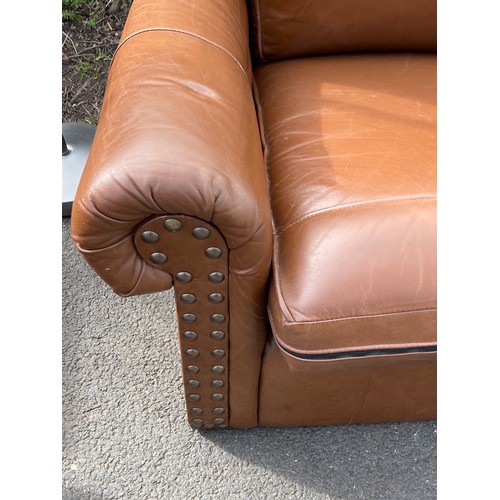 542 - Thomas Lloyd leather chair and footstool