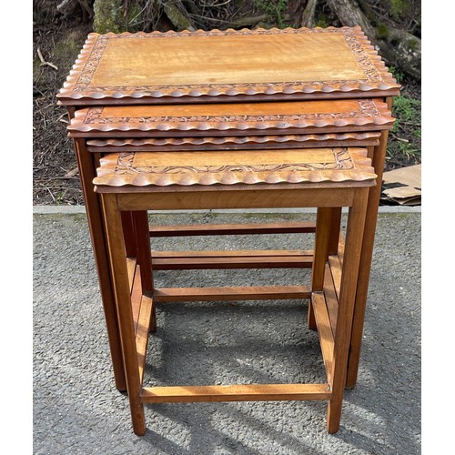 547 - Nest of 4 carved top fruit wood tables