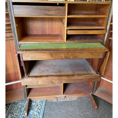 518 - Vintage teak desk in a box when it is closed this looks like an ordinary cabinet, but unfolded revea... 