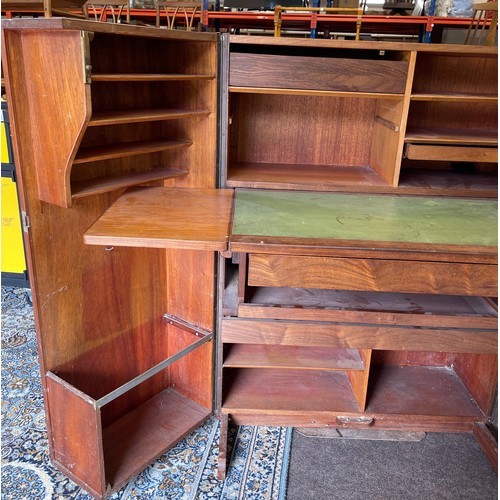 518 - Vintage teak desk in a box when it is closed this looks like an ordinary cabinet, but unfolded revea... 