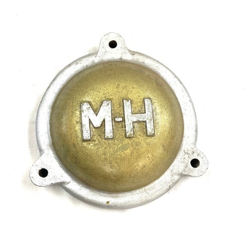 73 - Cast Vintage M H (Massey Harris) possibly cover, approximate measurements: 9 inches diameter