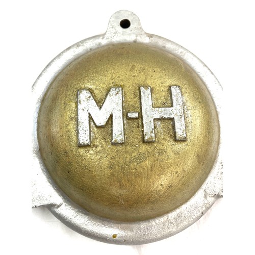 73 - Cast Vintage M H (Massey Harris) possibly cover, approximate measurements: 9 inches diameter