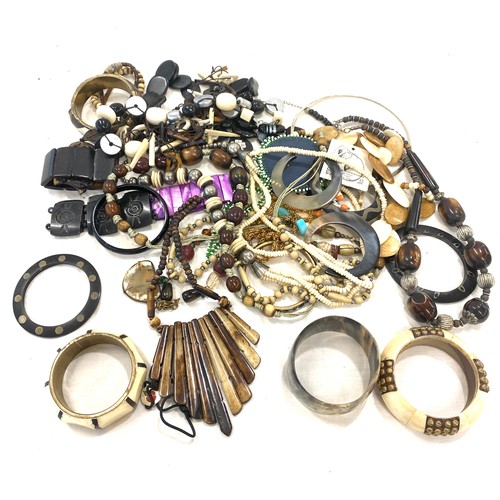 575 - Box of vintage costume jewellery to include bone pieces