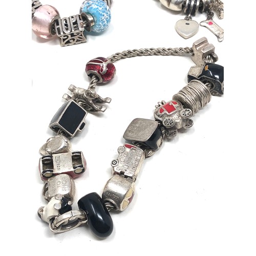 343 - 4 silver mixed brand charm bracelets & charms