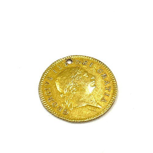 552 - 1804 gold half guinea, good grade, has drill hole as seen in image