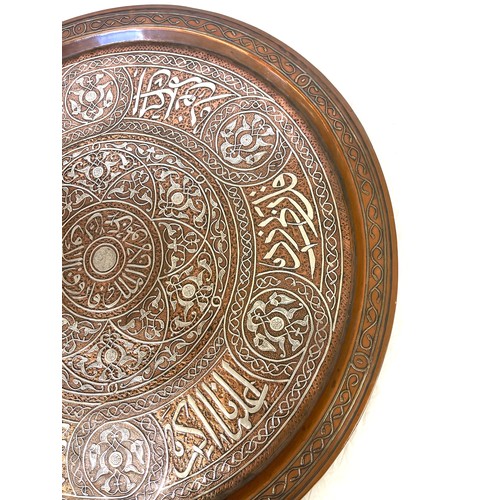 433 - Mamluk revival silver inlaid copper tray of shallow form, engraved and decorated in silver inlay, ap... 