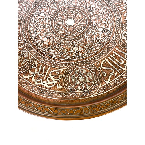 433 - Mamluk revival silver inlaid copper tray of shallow form, engraved and decorated in silver inlay, ap... 