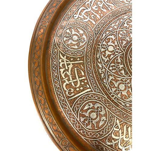 433 - Mamluk revival silver inlaid copper tray of shallow form, engraved and decorated in silver inlay, ap... 