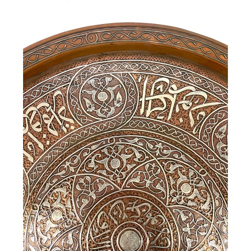 433 - Mamluk revival silver inlaid copper tray of shallow form, engraved and decorated in silver inlay, ap... 