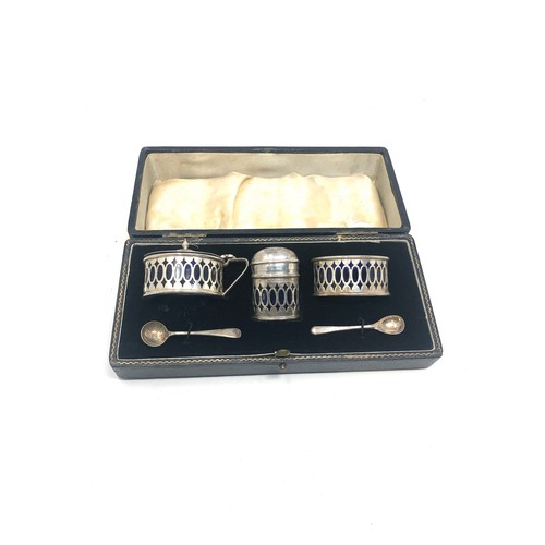 100 - Boxed silver cruet set with blue glass liners Birmingham silver hallmarks