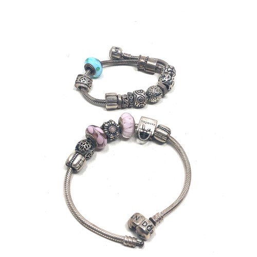 370 - 2 Pandora silver charm bracelets & charms