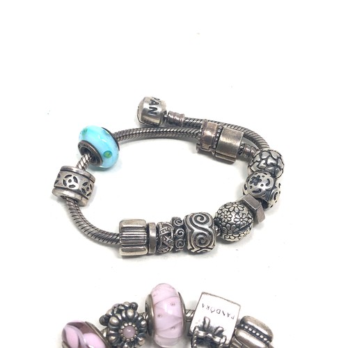 370 - 2 Pandora silver charm bracelets & charms