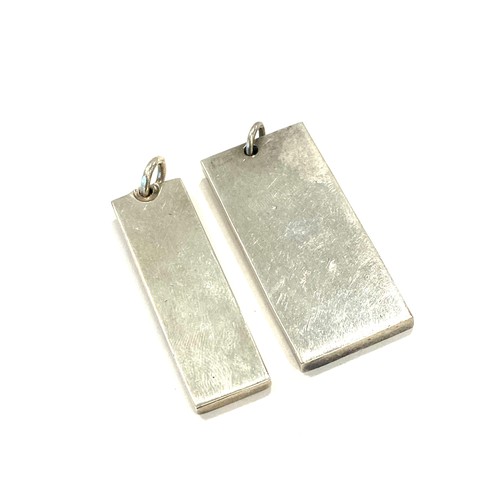 561 - 2 Silver ingots, total approximate weight 37.2g