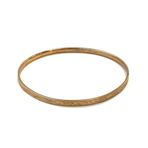 557 - 9ct slave bangle, metal core