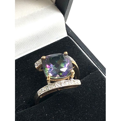 124 - 9ct gold diamond & mystic topaz dress ring weight 4.2g