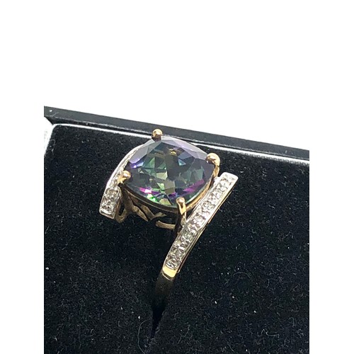 124 - 9ct gold diamond & mystic topaz dress ring weight 4.2g