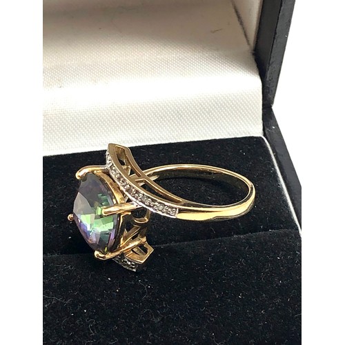 124 - 9ct gold diamond & mystic topaz dress ring weight 4.2g