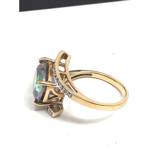 124 - 9ct gold diamond & mystic topaz dress ring weight 4.2g