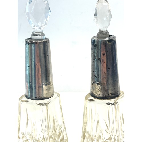 544 - Pair Edwardian Silver collar scent bottles, non matching stoppers, damage to neck inset as seen in i... 